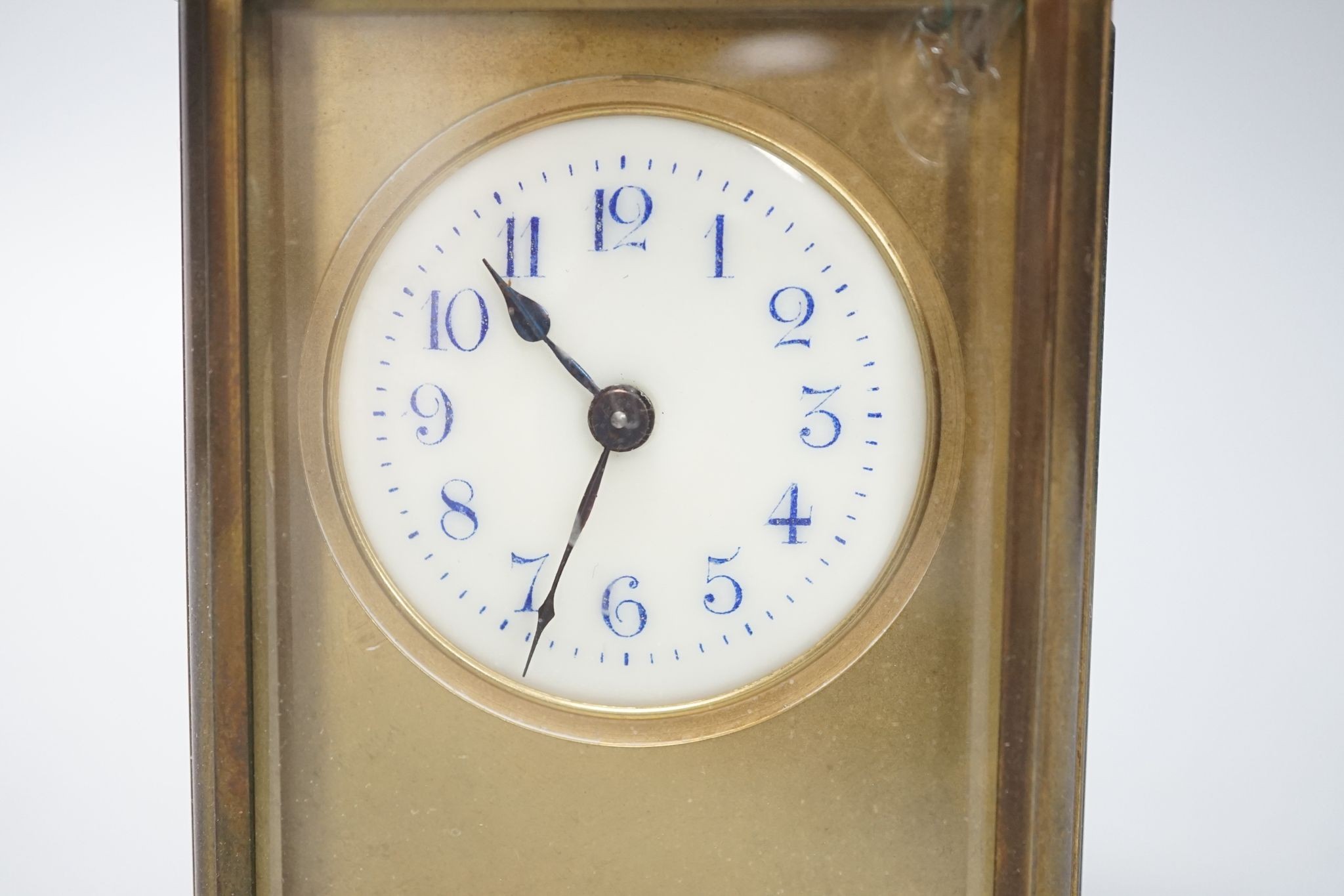 A cased brass carriage timepiece, 10.5 cms high high not including case.